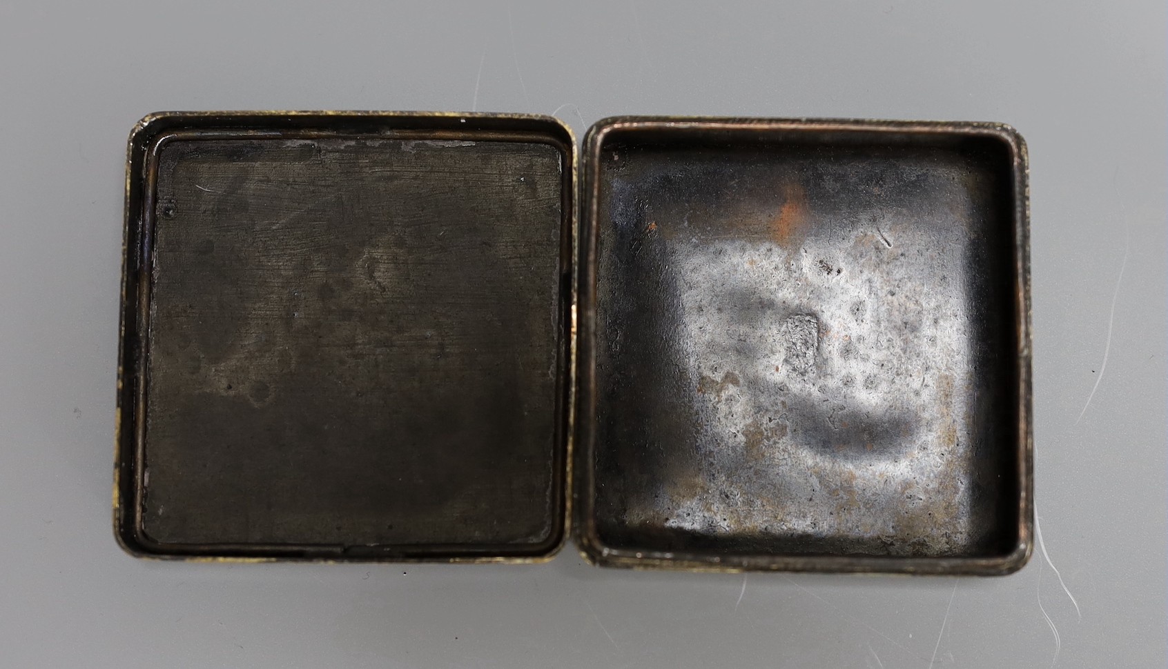 Four Chinese inscribed bronze ink boxes, 7cm sq